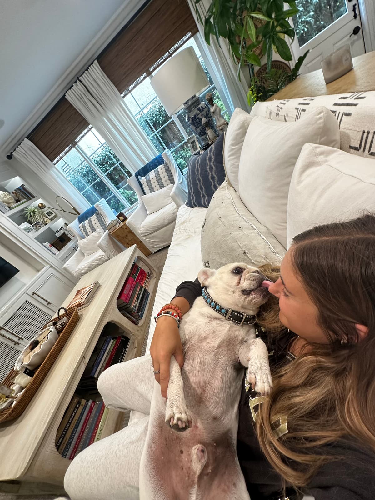 Stephanie with French Bulldog on the couch
